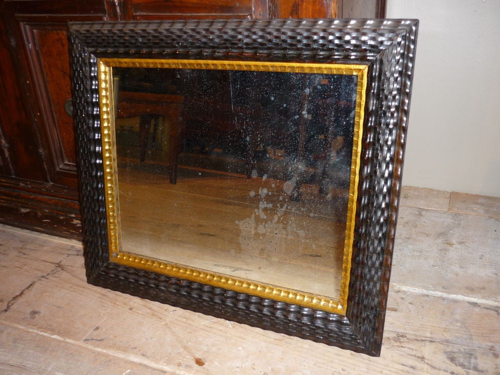 Mirror frame in the classic Dutch Baroque ripple style with gilt inner molding and original glass, 19th century.