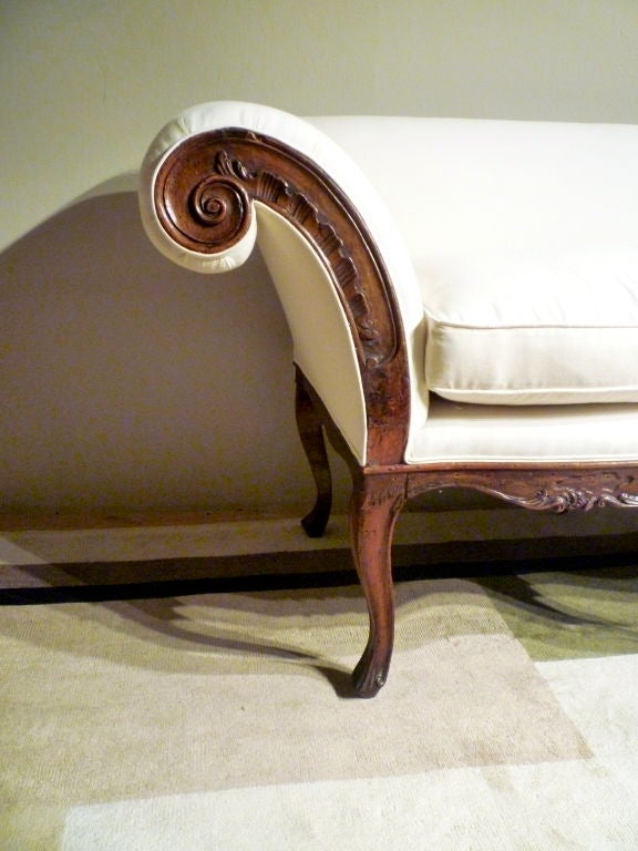 Charming Venetian Rococo walnut upholstered settee with outscrolling arms and cabriole legs.