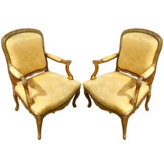 Pair of French Regence Giltwood Armchairs