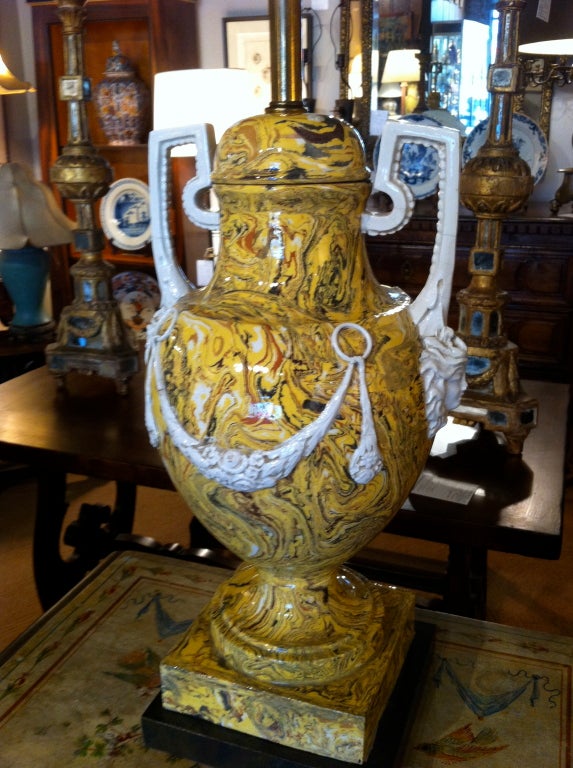 Marvelous pair of Italian neoclassical style agate ware urn form ceramic lamps. Decorated with floral swags and masks.