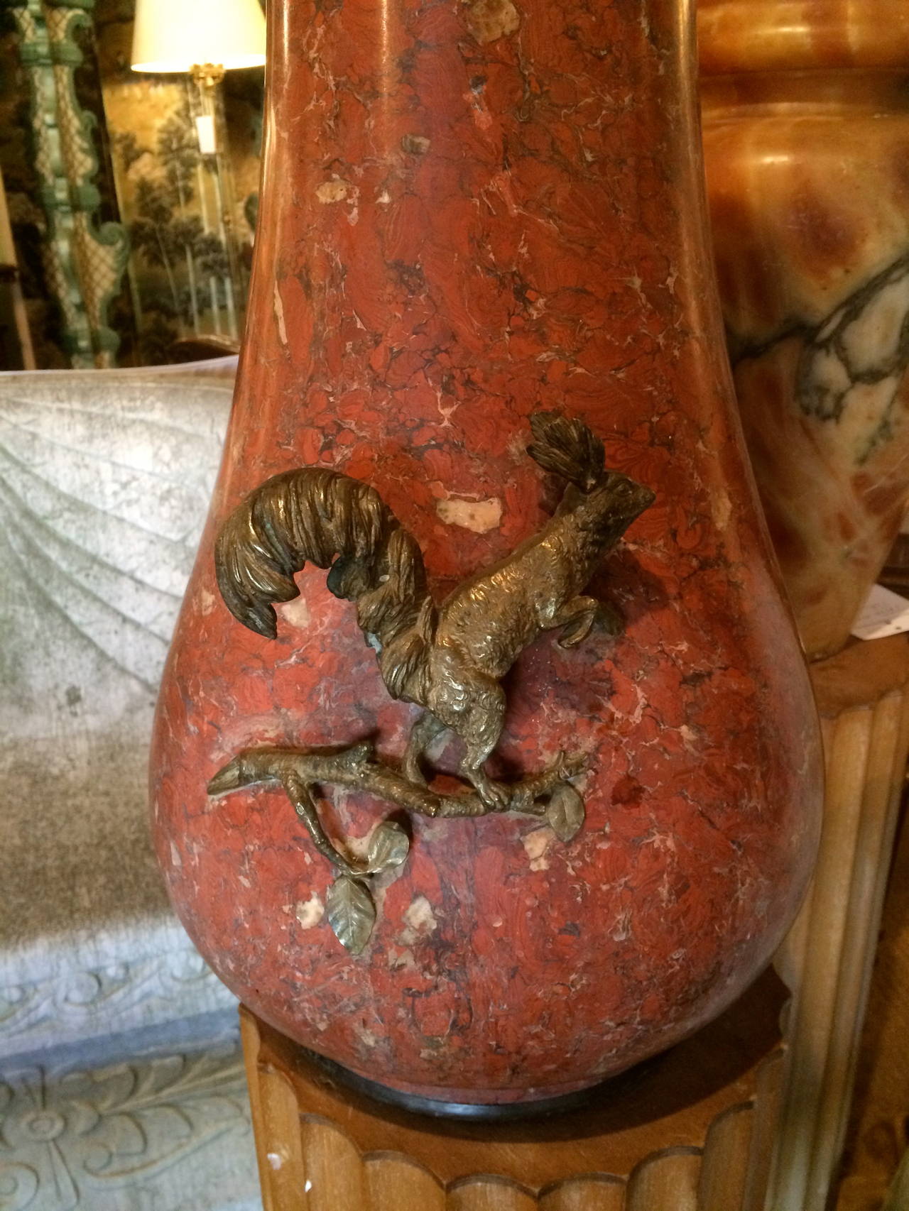 Unusual large-scale 19th century, Austrian rouge marble vase with bronze mounts depicting a Eurasian red squirrel on the front and a tree branch on the reverse. Both whimsical and elegant. Polished rouge marble. Signed Schumacher with a metal