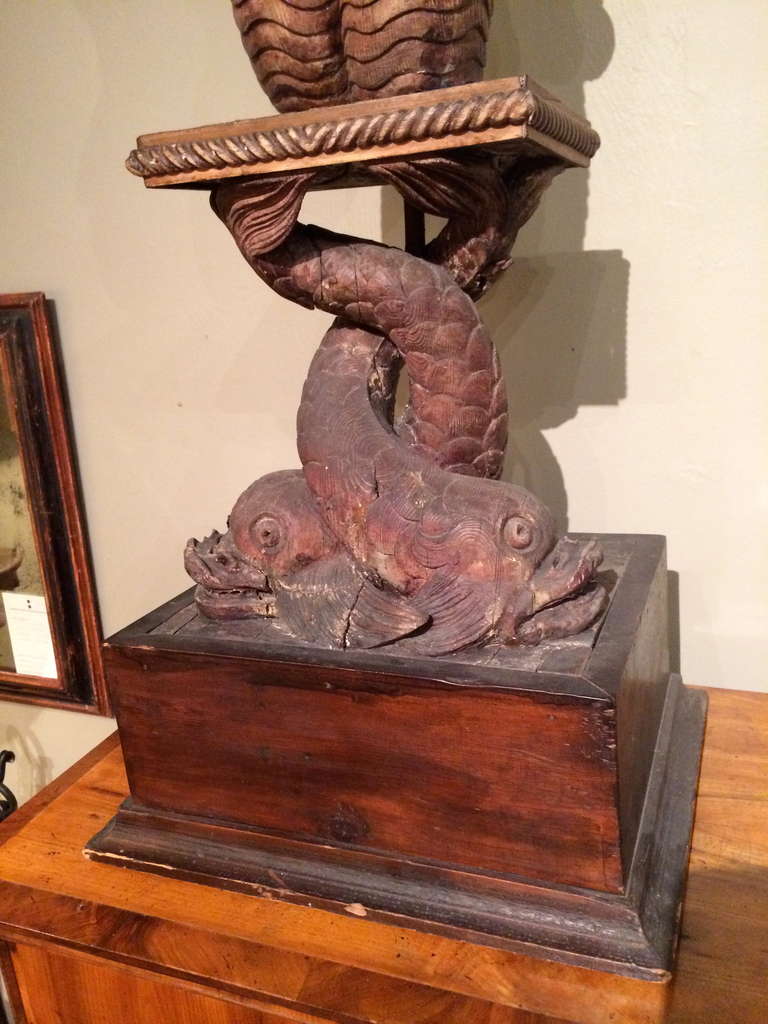 Exceptional pair of Italian 18th century pedestals carved in the form of mermaids kneeling above pairs of dolphins with tails interlocking. Superb carving throughout, especially the mermaids double tails. Venetian.