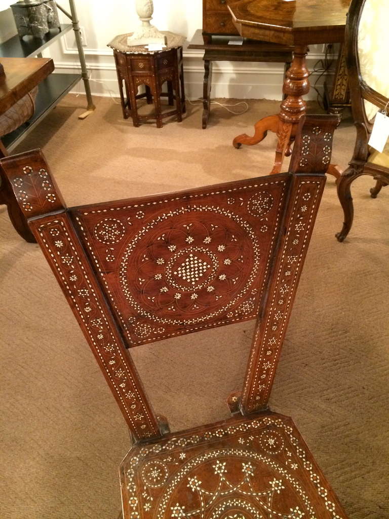 Rare 16th century Italian walnut side chair with intricate bone inlay. Decorated throughout 'a la certosina'.
Certosina is a decorative art technique used widely in the Italian Renaissance period. Similar to marquetry, it uses small pieces of wood,