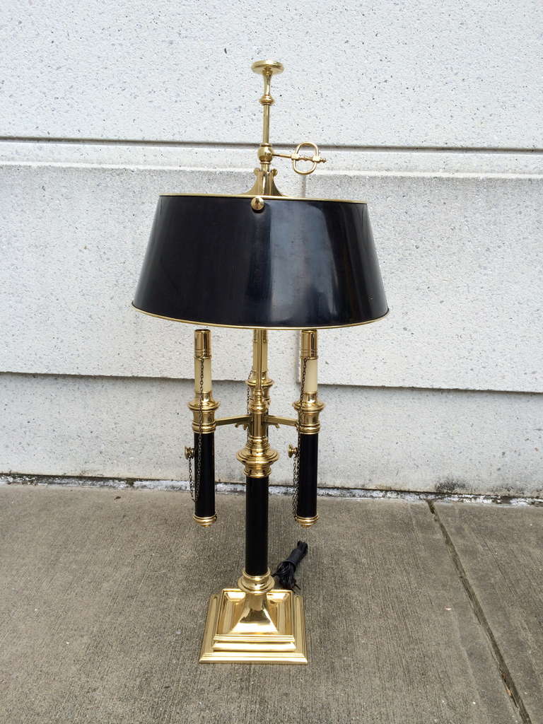 Pair of handsome and elegant Regency style brass library lamps with black painted brass shades.