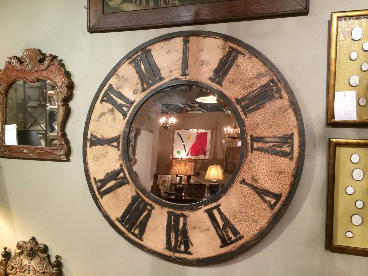 Vintage French painted iron clock face mirror, with Roman numerals.
