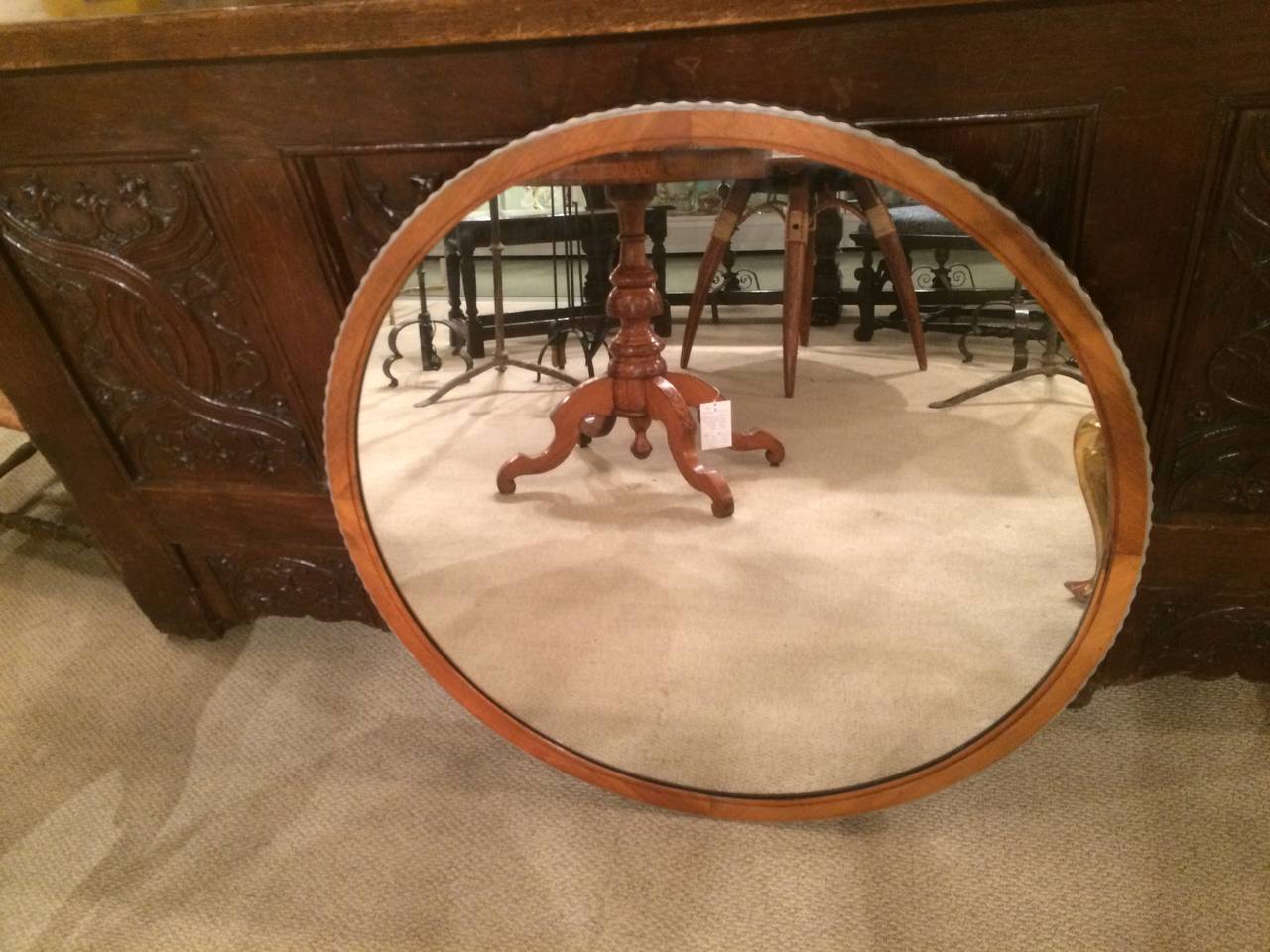American modernist round mirror of walnut with a rippled edge in silver paint. Prize winning design by Robert W. Irwin, Grand Rapids, Michigan, 1933. 

This is part of a bedroom suite, two chests of drawers, one tall, a single bed and this mirror.