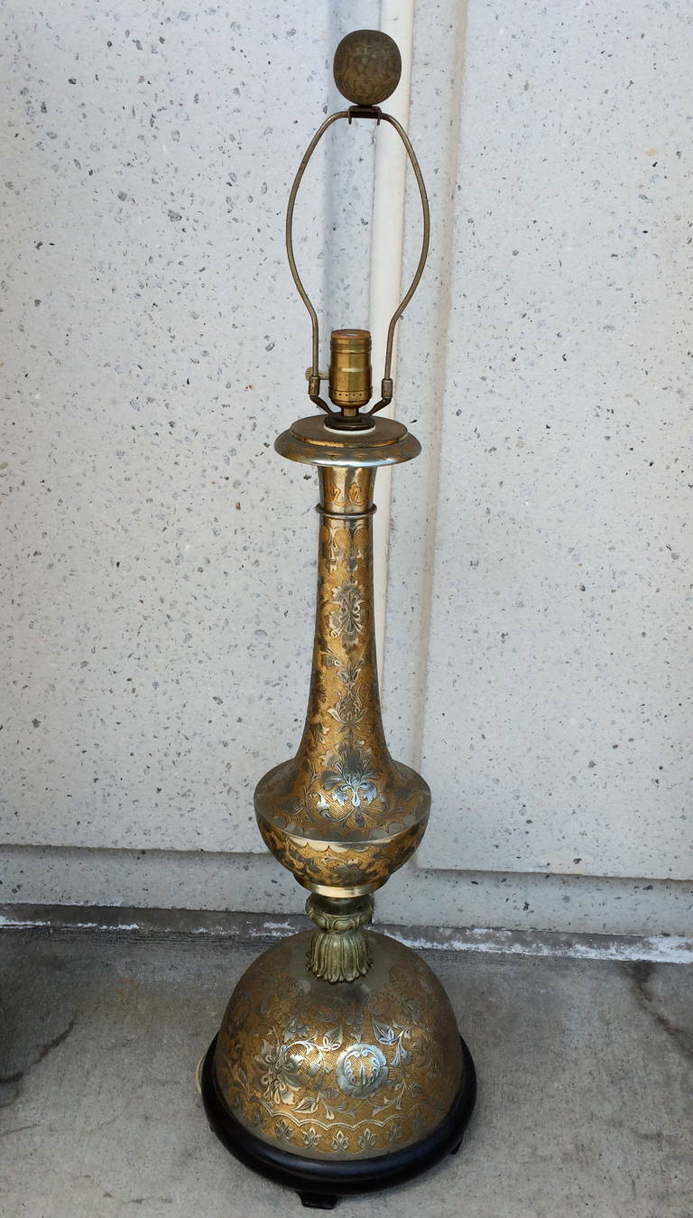 Pair of etched and silvered brass table lamps from India made in the Persian style. Large-scale and beautifully proportioned with delicate integrated decoration.