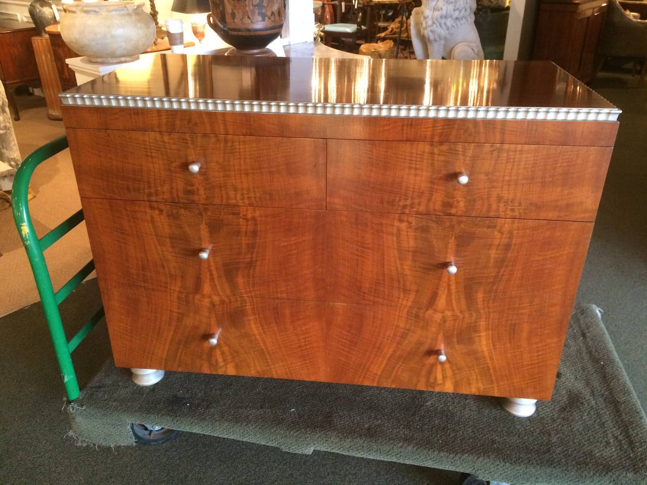 American modern figured walnut dresser with silver leaf details. The design by Robert W. Irwin for this suite won first prize in the National designer contest sponsored by the American walnut manufactures association in 1933. 

Entire bedroom
