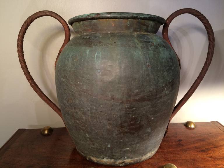 Large scale Italian verdigris copper urn with wrought iron handles. Great piece for garden or interior. 18/19th century.