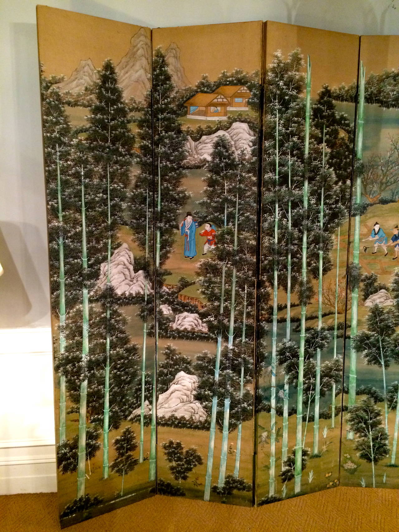 Fantastic large-scale Chinese hand-painted six-panel screen depicting a bamboo forest interspersed with groups of figures and rock outcroppings. Hand painted paper laid down on board. The vertical lines of the bamboo trees give this screen a very