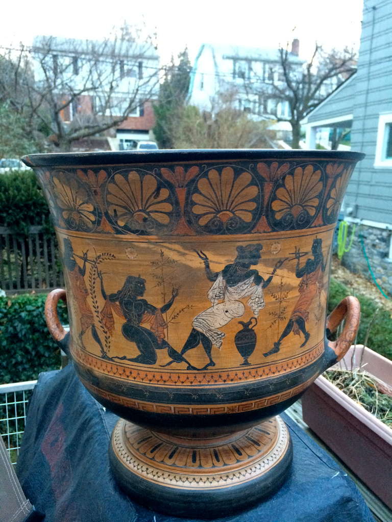 Large scale Greek krater in the ancient style painted with figures of naked warriors in various poses. Decorated with scenes from mythology. Though previously broken and repaired, does not take away from the appeal of this piece.