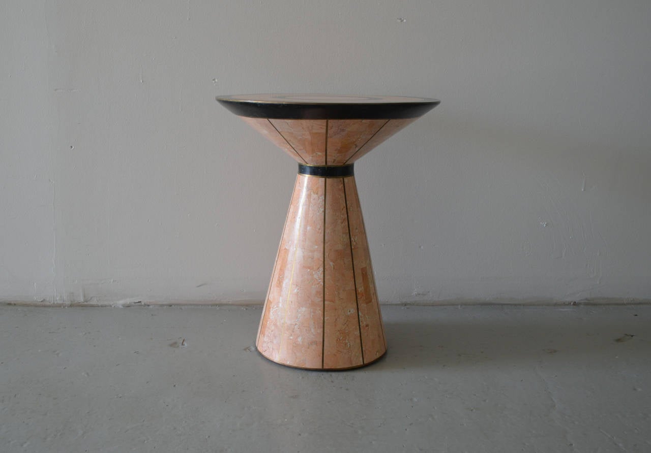 Finely crafted pink and black tessellated marble side table with seamless brass inlay.