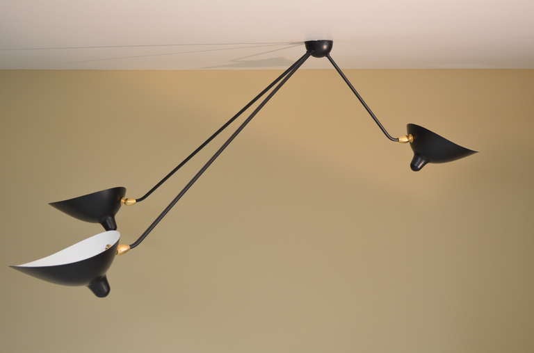 A slight angle at the end of each arm allows this Classic design to be equally at home on the ceiling. With rotating heads on fixed arms, the versatility is only rivaled by it beauty.

The entire collection of licensed Serge Mouille lighting