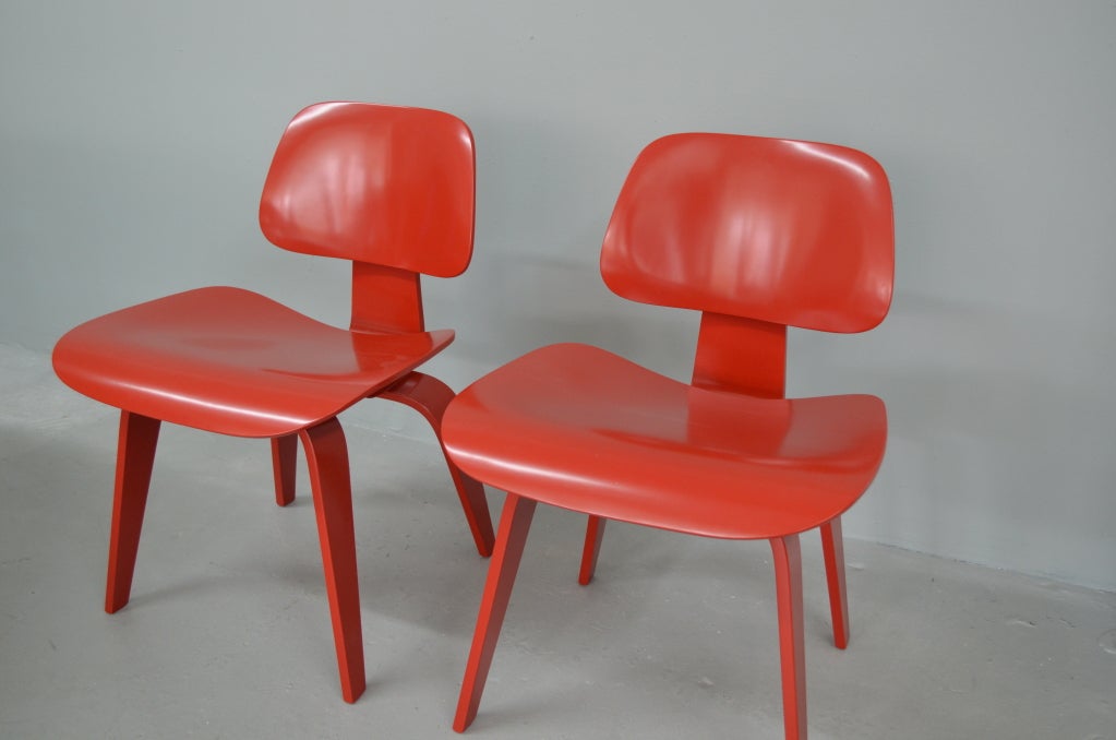 Original Charles and Ray Eames molded plywood dining chairs made molded plywood dining chairs made in mid 1940's. Made by Evans Products , distributed by Herman Miller, newly repainted in red