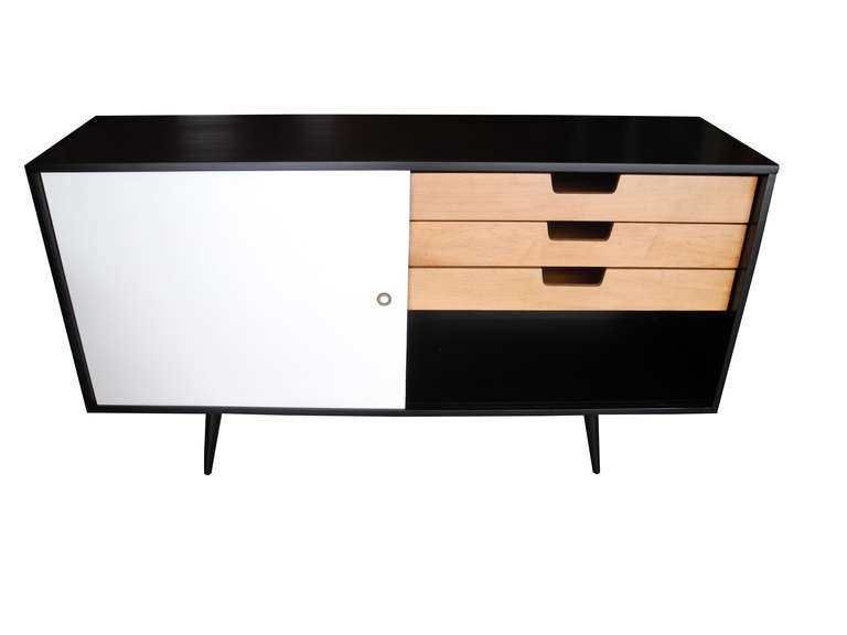 This sideboard has been fully restored. Equipped with four interior drawers and a single shelf. The doors are original to the piece.