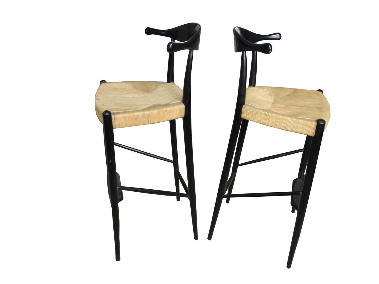 The bar stools are made of painted black wood. The paint is original.
The seats are rush. The backs are uniquely designed in Horn like shapes or ox bow, an American design from the late 1950s.
The seat height is 27.5