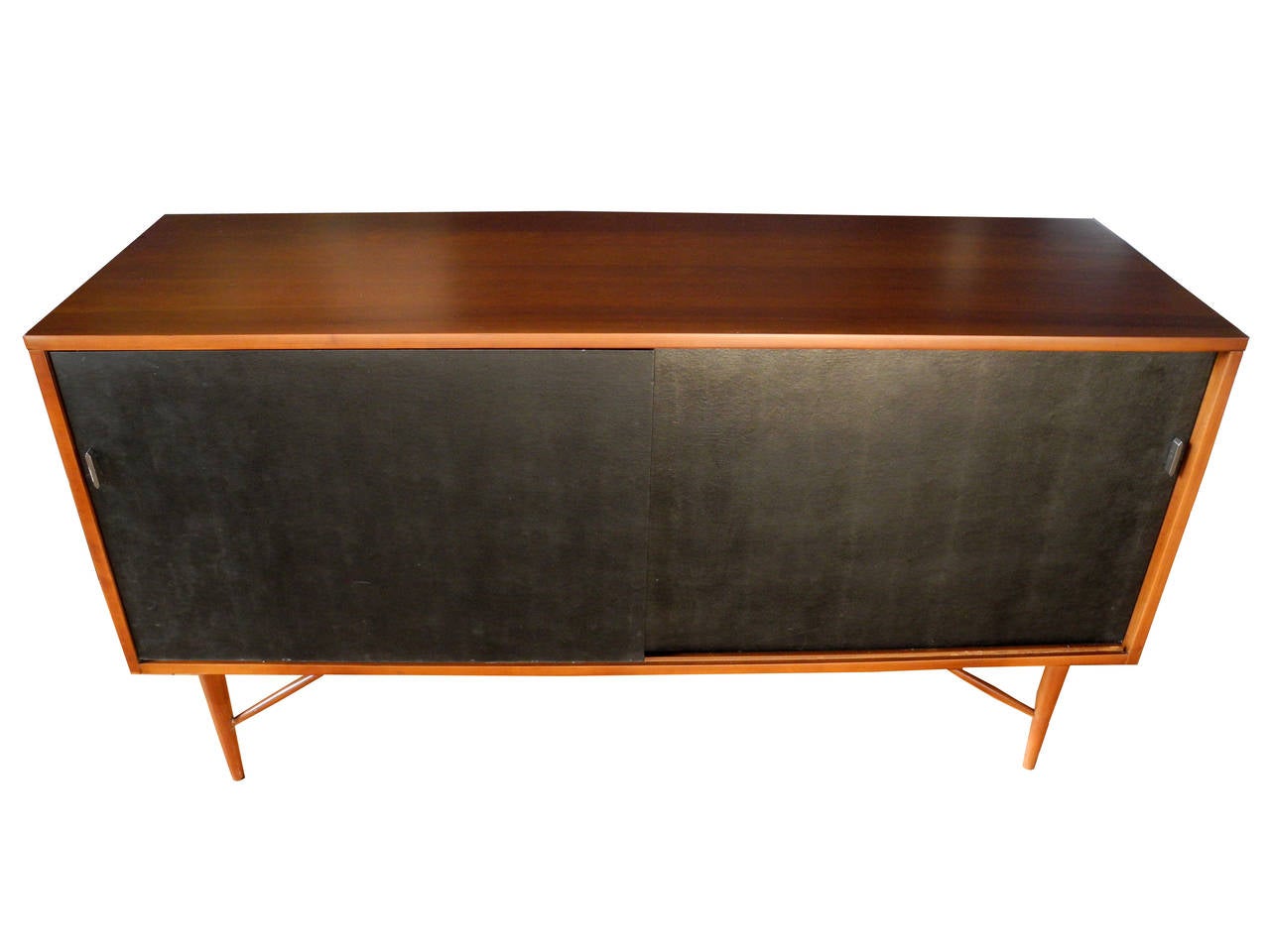 This cabinet is made of solid cherrywood. The doors are covered in black naugahyde leather. The handles are cut steel. This case piece can be used as a credenza for office storage or in the dining room for sideboard use. Also, there is a spot for
