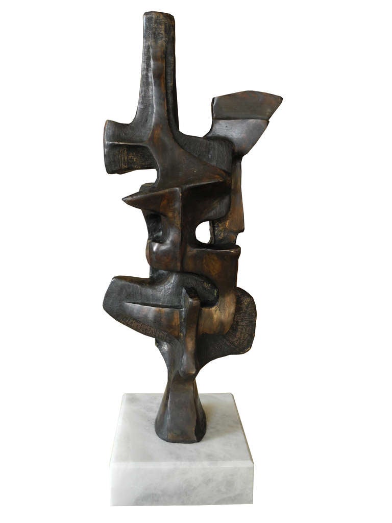 This is an artist's proof out of nine bronze castings mounted on a white marble block. It's signed and stamped.

Marble base is 6x6x2. The measurements of just the sculpture is 17.75