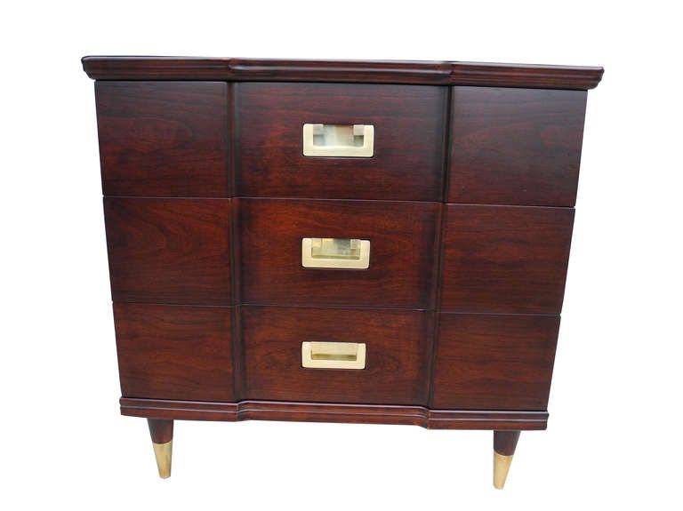 These beautifully made small dressers are perfect bedside sized tables stained in an espresso color. Each consisting of three drawers. Made of solid cherry wood, solid brass flush mount pulls and brass sabots.