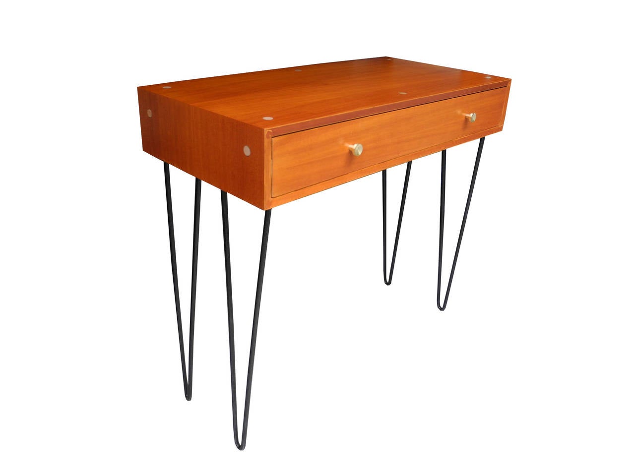 This case piece is made of mahogany, black metal legs and solid brass drawer pulls. The height the case is six inches.