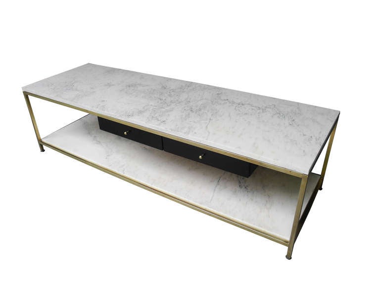 1950s brass and marble two-tier coffee table with two mahogany shelves.
Marble is new in a honed finish. Frame and drawers are original.