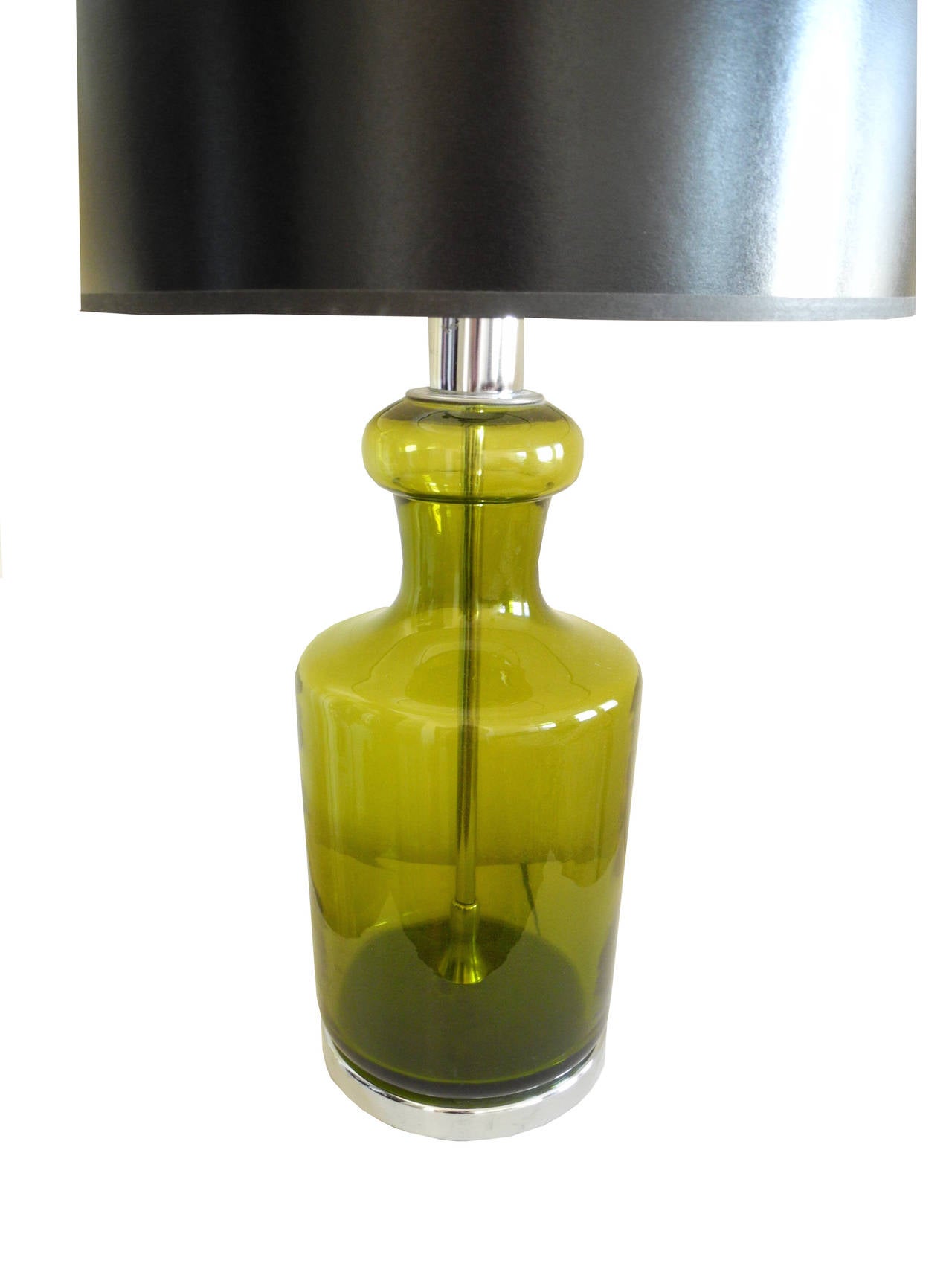This vintage lamp is a glass vessel with a chrome base and interior rod. 
The shade is 16