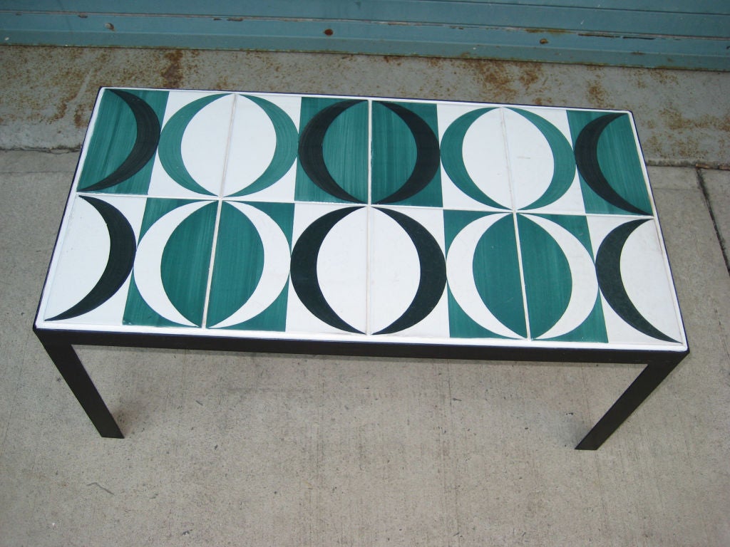 This table in green, white and black was made with ceramic tiles from a hotel designed by Gio Ponti.  The tiles are vintage but the frame is new. Cool and unique.<br />
<br />
For more art, furniture, and our blog visit: <br