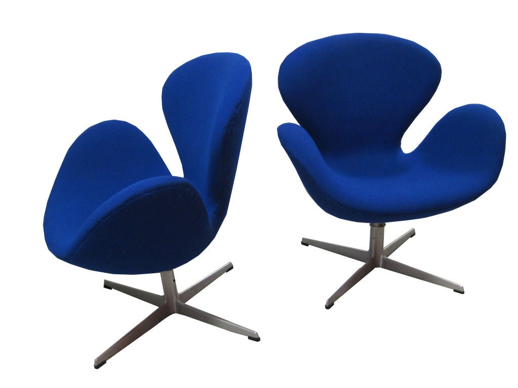 Make a statement with these iconic royal blue Arne Jacobsen chairs for Fritz Hansen. They tilt and swivel and have an adjustable height of 3-4 inches. They are newly upholstered and too good to pass up!<br />
<br />
For more art and furniture