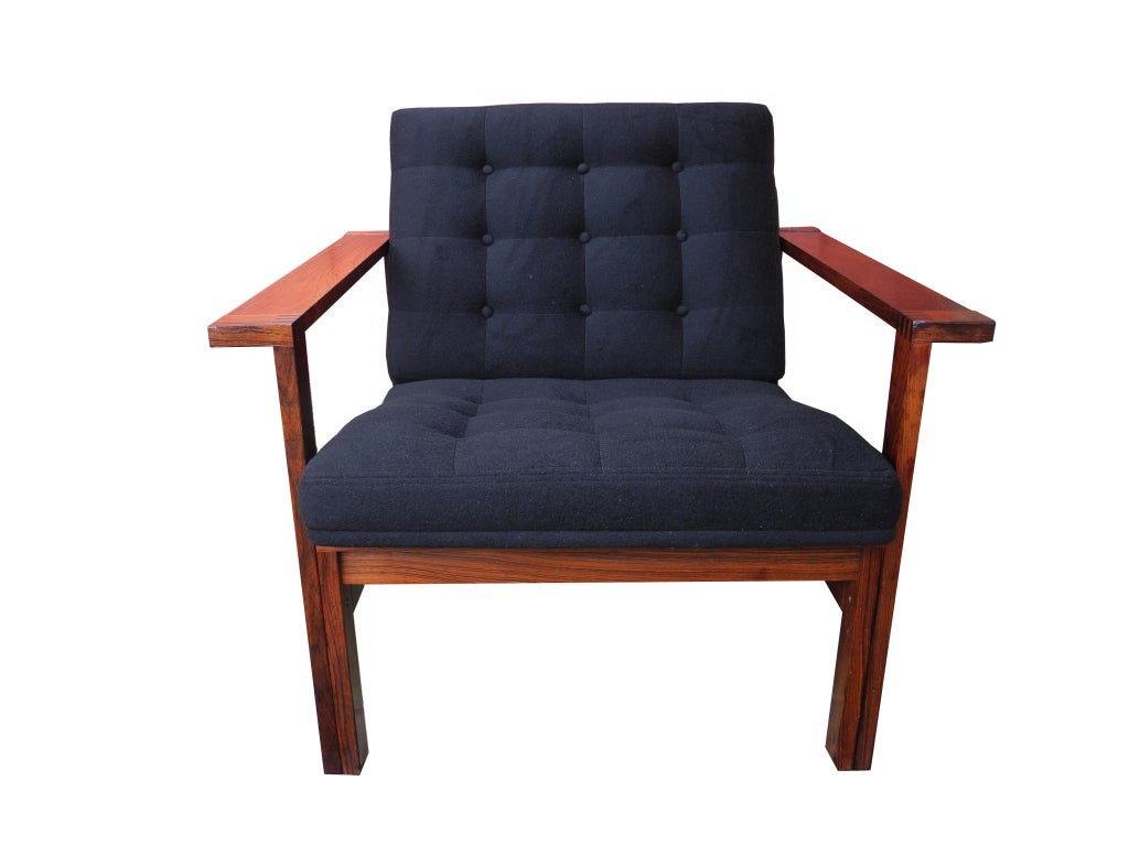 Danish armchair made of a rosewood frame and black cashmere upholstery. The top of the arm is 21