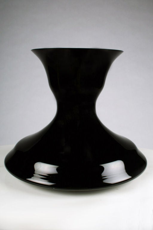 A handblown vase in black amethyst color glass in a hypnotic 'genie' bottle form. After Sergio Asti. Italy, circa 1970.