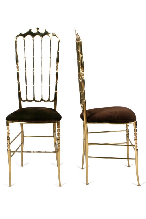 A wonderful pair of brass side chairs with shapely crest rails and spindled backs and with velvet upholstery. By Chiavari, Italy, circa 1950. Price COM.