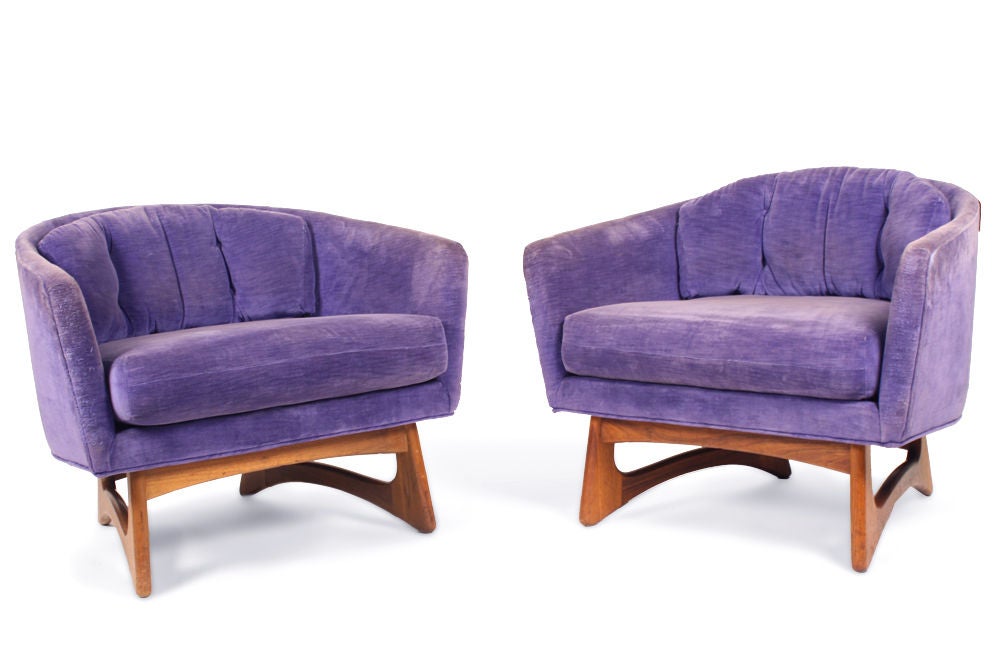 A pair of low and wide barrel lounge chairs supported by a sculpted walnut open frame base. By Adrian Pearsall for Craft Associates. U.S.A., circa 1960. [DUF0295]
