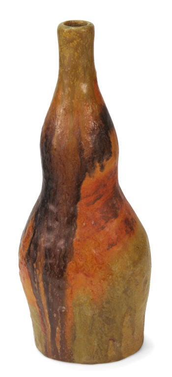 A beautiful ceramic vase in earth-tone colors of orange, crimson, and ochre with a narrow neck and a double bulbous body. Signed to the underside. By Marcello Fantoni for Raymor. Italy, circa 1950.