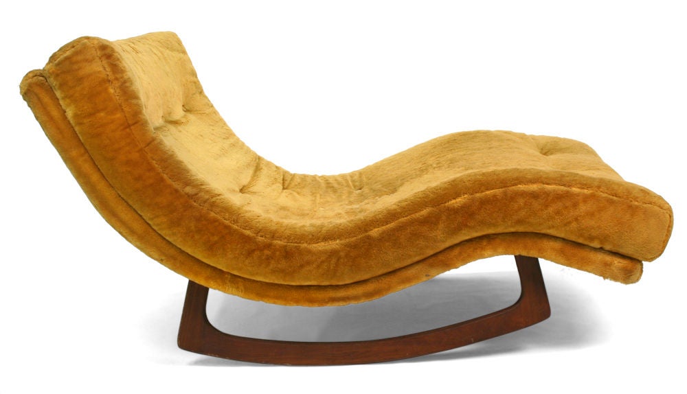 A pair of low and wide chaise longues with a wave form upholstered lounge supported on a sculpted wood rocking base. By Adrian Pearsall for Craft Associates, Inc.. U.S.A., circa 1960. Price COM.
