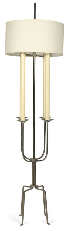 A wonderful floor lamp in nickel-plated steel with four arms and four legs. By Tommi Parzinger, American, circa 1950.