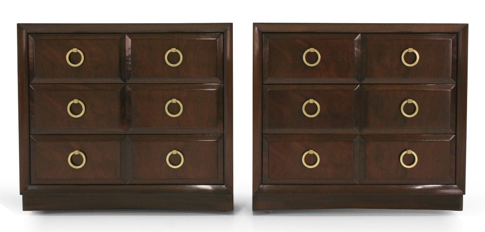 A pair of three drawer commodes with brass 
