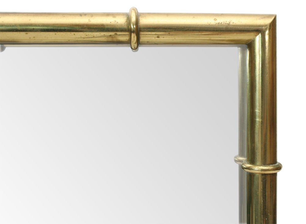 A rectangular mirror with brass faux bamboo frame. U.S.A., circa 1960.