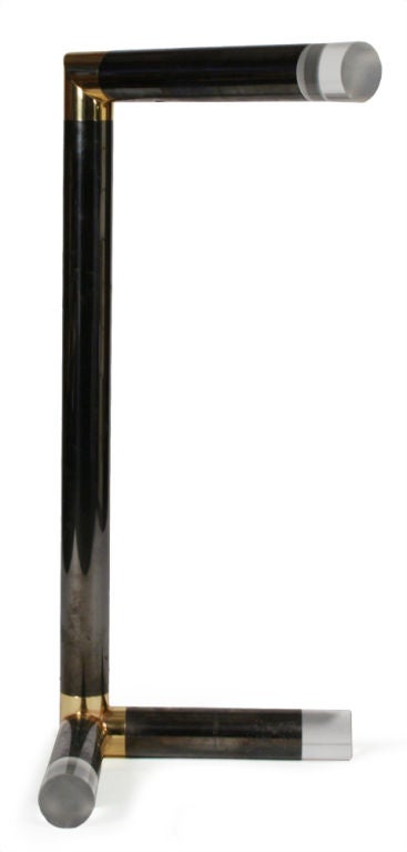 A chic and scarce floor lamp comprising a cantilevered top and an asymmetrical V-shaped base (17.5