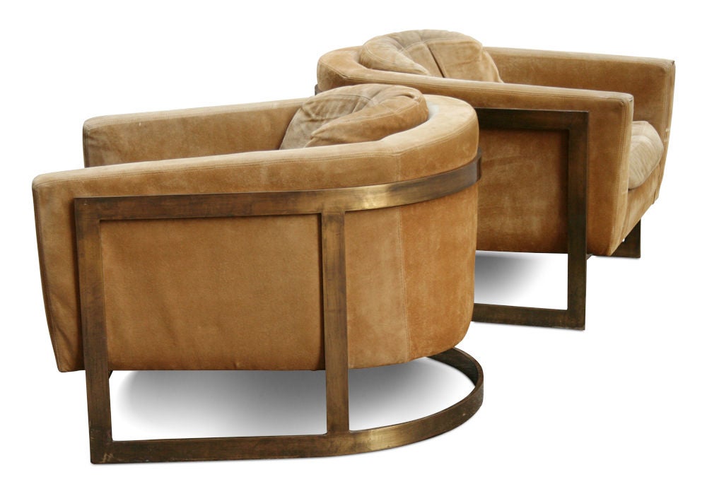 A substantial pair of barrel back lounge chairs with original suede upholstered tubs suspended in oil rubbed bronze finished frames. After Milo Baughman, American, circa 1960.

Price is COM.