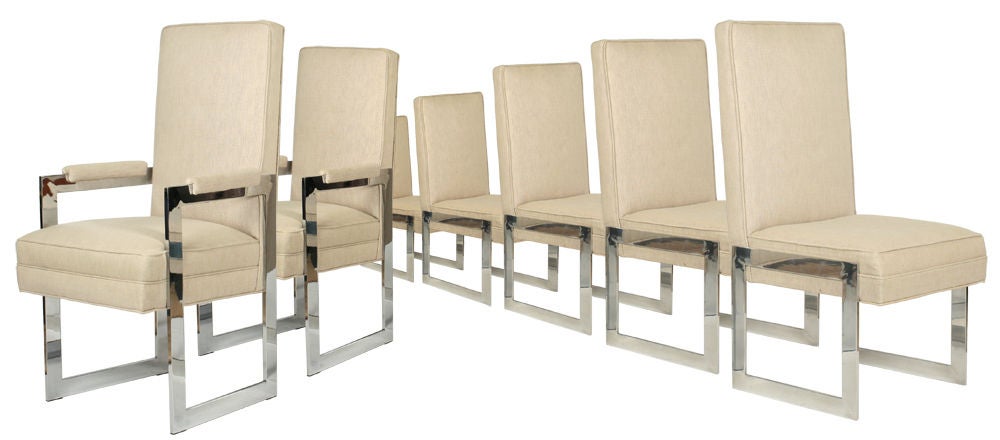 A set of eight dining chairs, two arms and six sides, comprised of high back fully upholstered seats supported on two open square form 'legs' of flat bar aluminum with a mirrored polish finish. By Pace, U.S.A., circa 1970. Price is COM. [DUF0578]