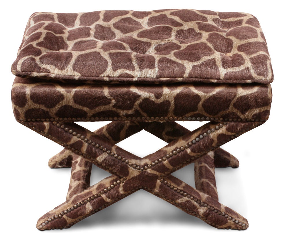 A fully upholstered X-frame bench in giraffe print pony skin with exposed nailhead details to the base. After Billy Baldwin. U.S.A., circa 1970. [DUF0109]