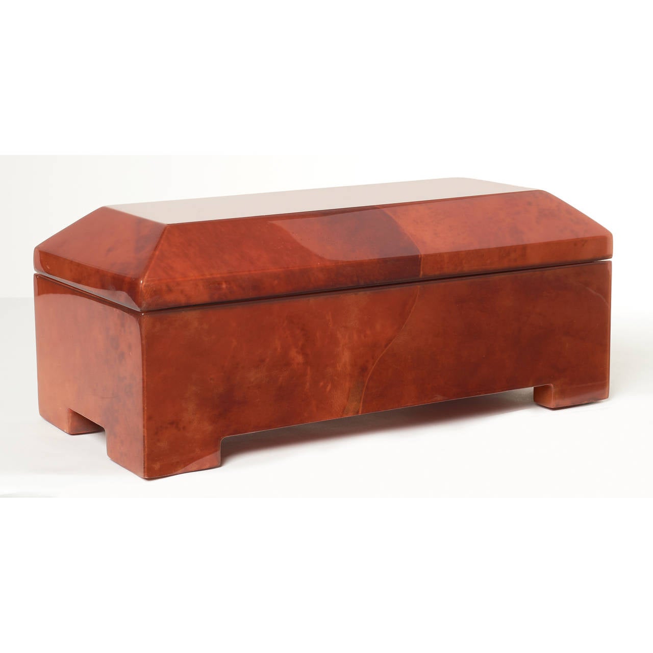 Casket form jewelry box wrapped in blood red dyed parchment. Hinged top opens to reveal felt lined interior. By Maitland-Smith. Philippines, circa 1980.
NYDC