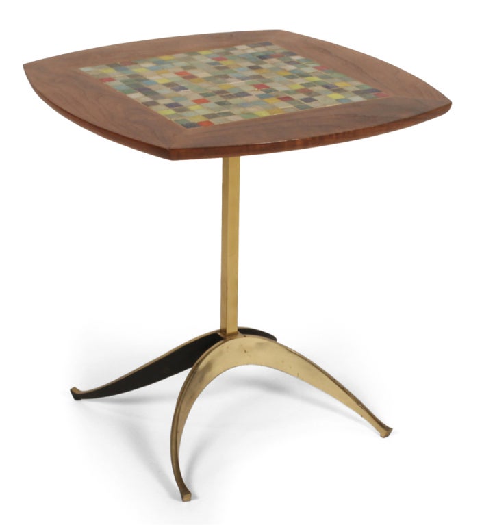A beautiful side table comprising a field of colorful mosaic glass tiles set in a hand rubbed oiled walnut frame resting on a square brass tube stem and raised on twin parabolic brass legs. Designed by Tony Paul for Westwood.  American, circa 1950's.