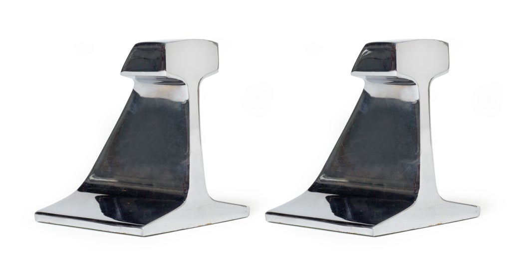 A bold set of bookends in a Machine Age form of railroad rail sections, all in chrome-plated steel. American, circa 1960.