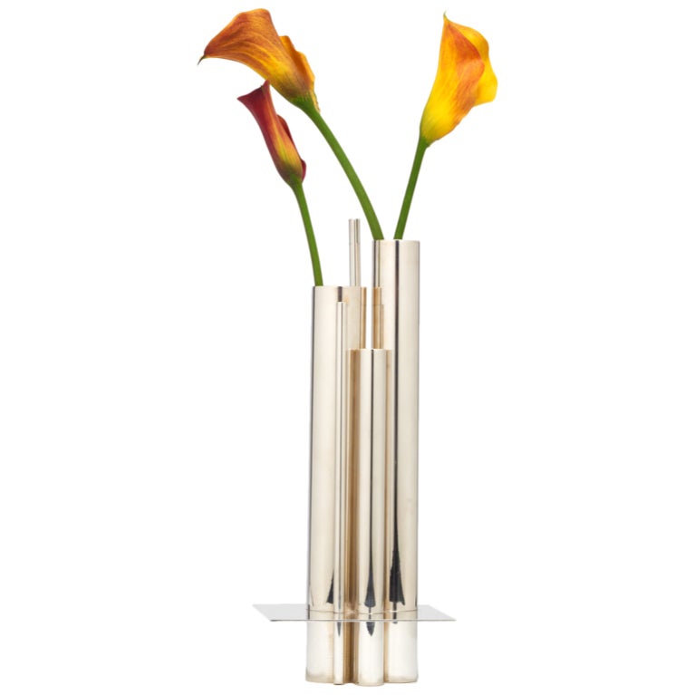 A chic vase comprising tubes in varying heights and diameters grouped together and raised on a thin plate, all in silver-plated brass. Stamped with manufacturer's hallmark to base. Designed by Jacques Sitoleux for Christofle, Collection Gallia.