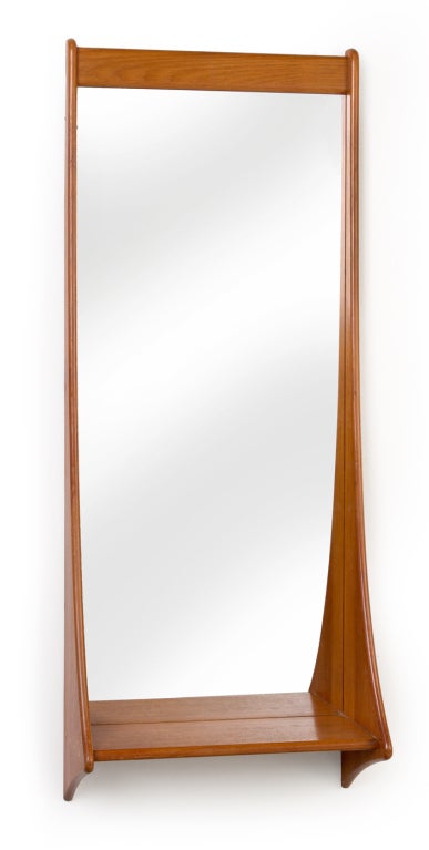 A tall entry way mirror in teak with integral shelf. By Pedersen and Hansen, Danish, circa 1950.

 