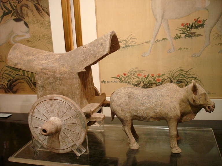 An unusual pottery statue of ox and cart on plexi stand, Tang dynasty 618-907, comes with Oxford authentication TL test certificate. Oxford TL test sample number C206b98.