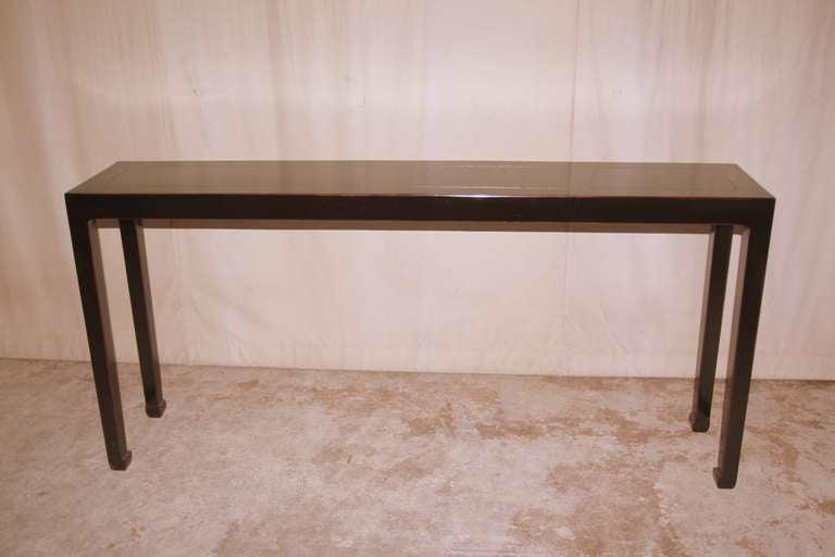 A simple and elegant black lacquer console table, beautiful color, form and lines.  We carry fine quality furniture with elegant finished and has been appeared many times in 