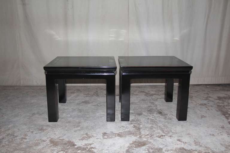 A pair of simple and refined black lacquer square end tables, beautiful color, form and lines.