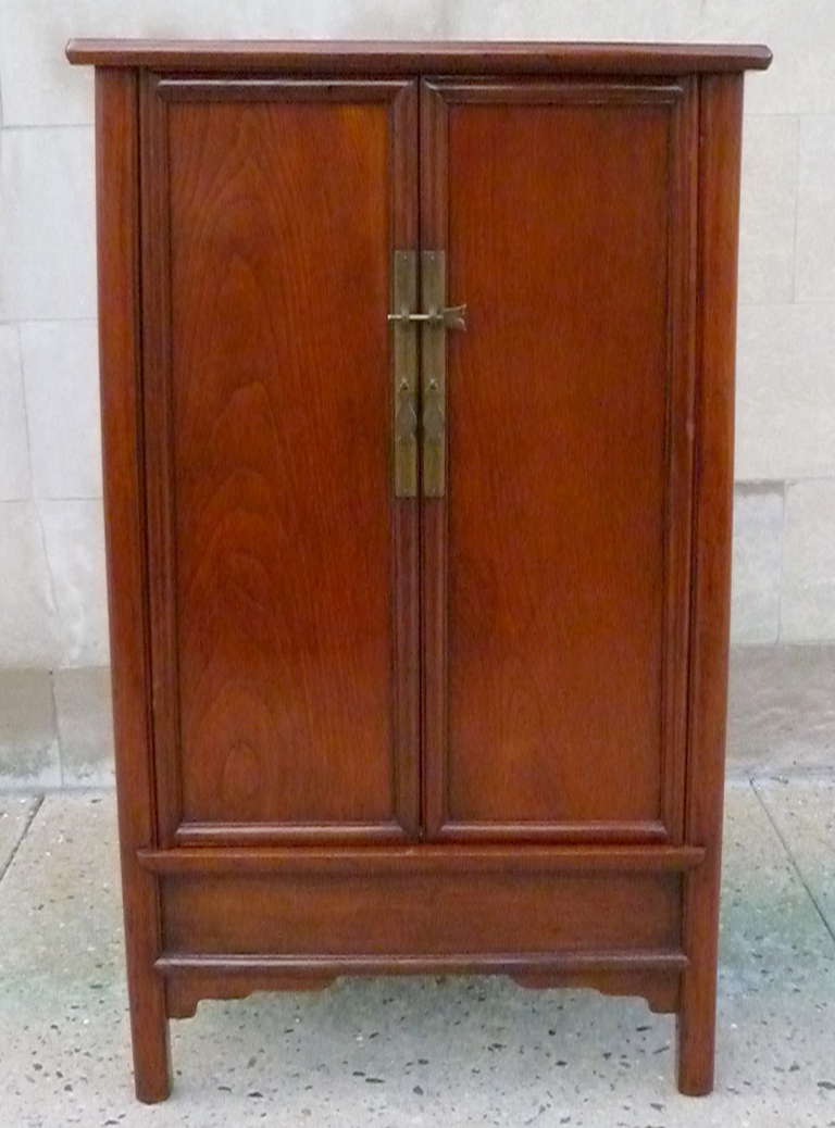 A refined and elegant tapered ju mu wood scholar's cabinet, elegant form, beautiful wood grain, 19th century,  We carry fine quality furniture with elegant finished and has been appeared many times in 
